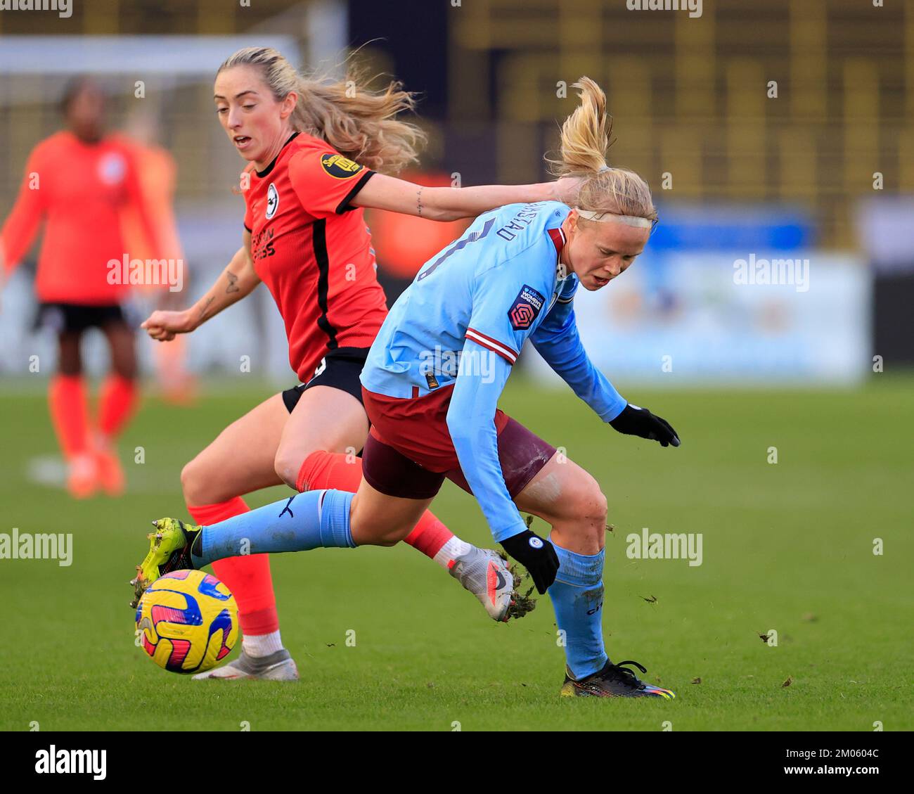 Megan Connolly #8 of Brighton tackles Julie Blakstad #41 of Manchester City during The FA Women's Super League match Manchester City Women vs Brighton & Hove Albion W.F.C. at Etihad Campus, Manchester, United Kingdom, 4th December 2022  (Photo by Conor Molloy/News Images) Stock Photo
