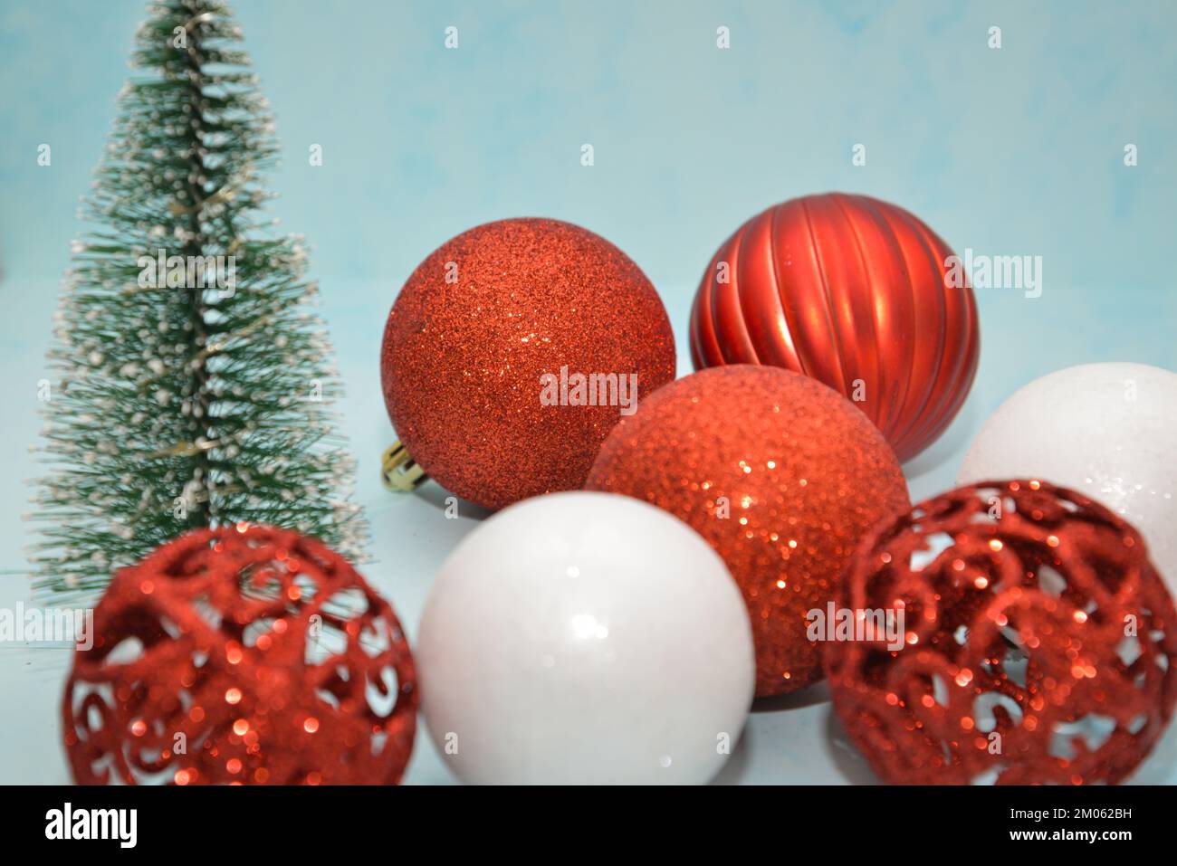 Christmas decorations on a light blue background, flat lay. Space for text Stock Photo