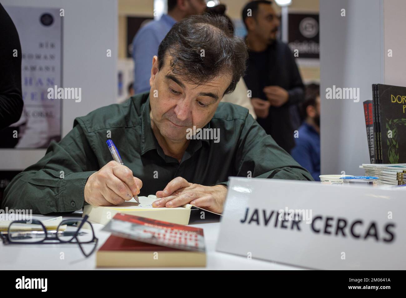 Istanbul, Turkey. December 4, 2022: Famous Spanish writer Javier Cercas is signing his books for his fans on the signing day of the 39th International Istanbul Book Fair in Beylikduzu, Istanbul Turkiye on December 4, 2022. The International Istanbul Book Fair opened its doors for the 39th time at TUYAP Istanbul Fair and Congress Center after the Covid-19 outbreak. Organized by TUYAP, Tum FuarcÄ±lÄ±k YapÄ±m AS, in cooperation with the Turkish Publishers Association, the fair themed Book Returns to the City will continue until 11 December. (Credit Image: © Tolga Ildun/ZUMA Press Wire) Credit: ZU Stock Photo