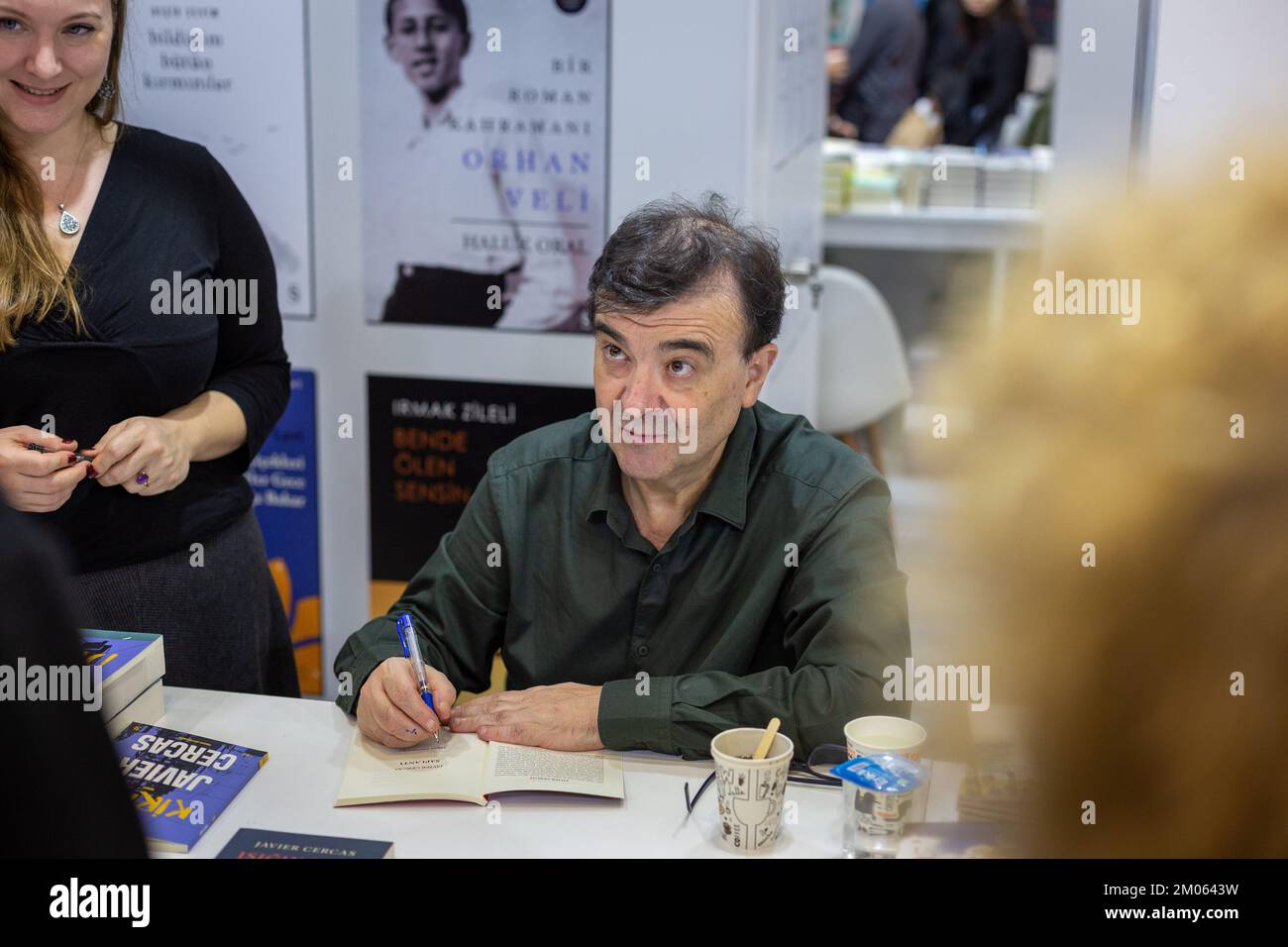 Istanbul, Turkey. December 4, 2022: Famous Spanish writer Javier Cercas is signing his books for his fans on the signing day of the 39th International Istanbul Book Fair in Beylikduzu, Istanbul Turkiye on December 4, 2022. The International Istanbul Book Fair opened its doors for the 39th time at TUYAP Istanbul Fair and Congress Center after the Covid-19 outbreak. Organized by TUYAP, Tum FuarcÄ±lÄ±k YapÄ±m AS, in cooperation with the Turkish Publishers Association, the fair themed Book Returns to the City will continue until 11 December. (Credit Image: © Tolga Ildun/ZUMA Press Wire) Credit: ZU Stock Photo