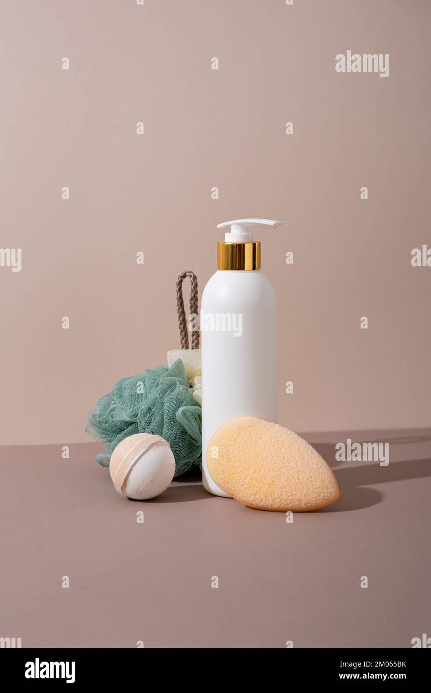 Body care concept white bottle soap and washcloth Stock Photo