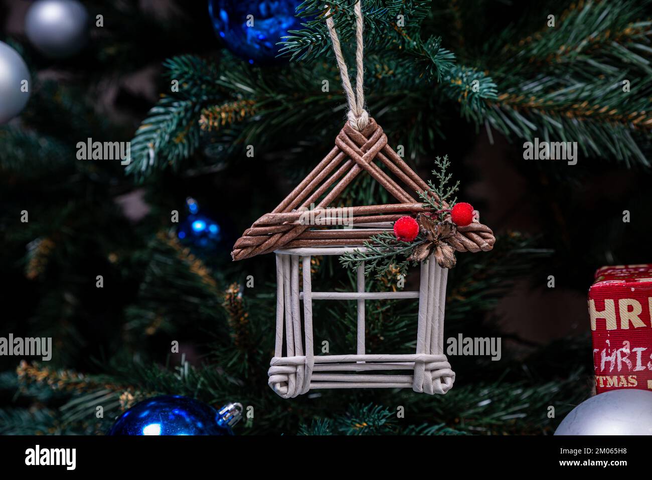 christmas tree with colorful balls and gift boxes over white brick wall ...