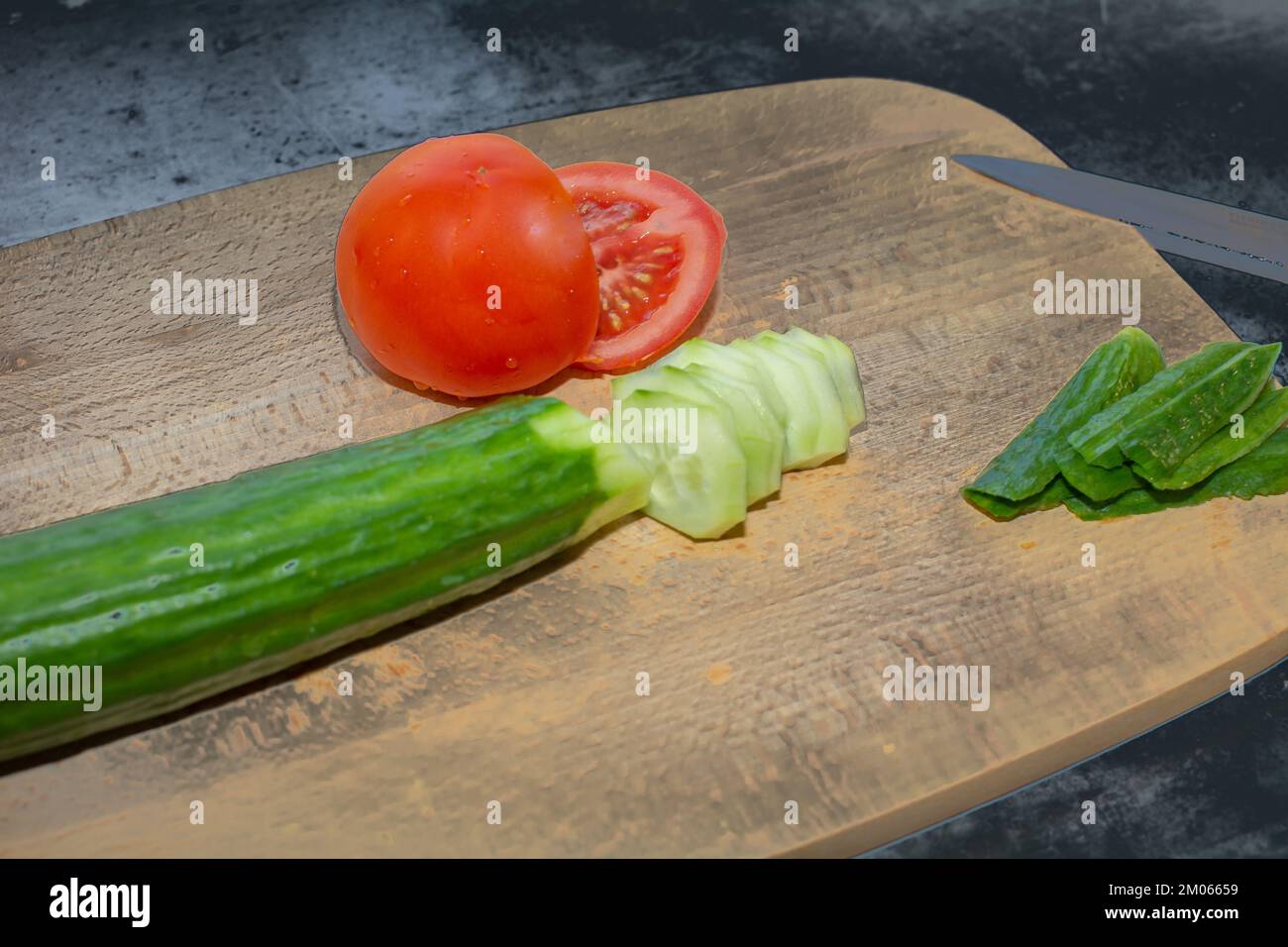 Sliced tomato and cucumber with every meal Stock Photo - Alamy