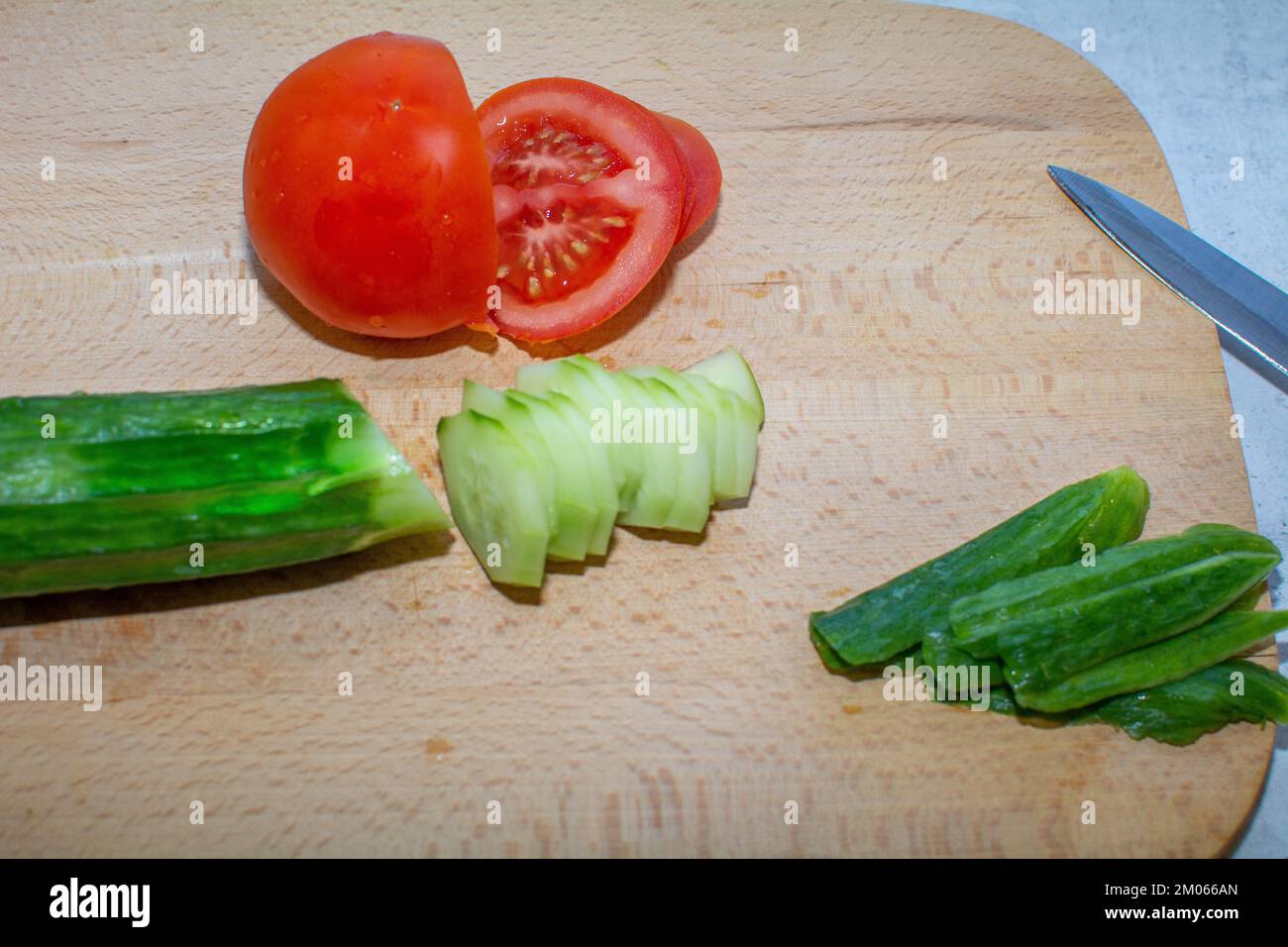 Sliced tomato and cucumber with every meal Stock Photo - Alamy