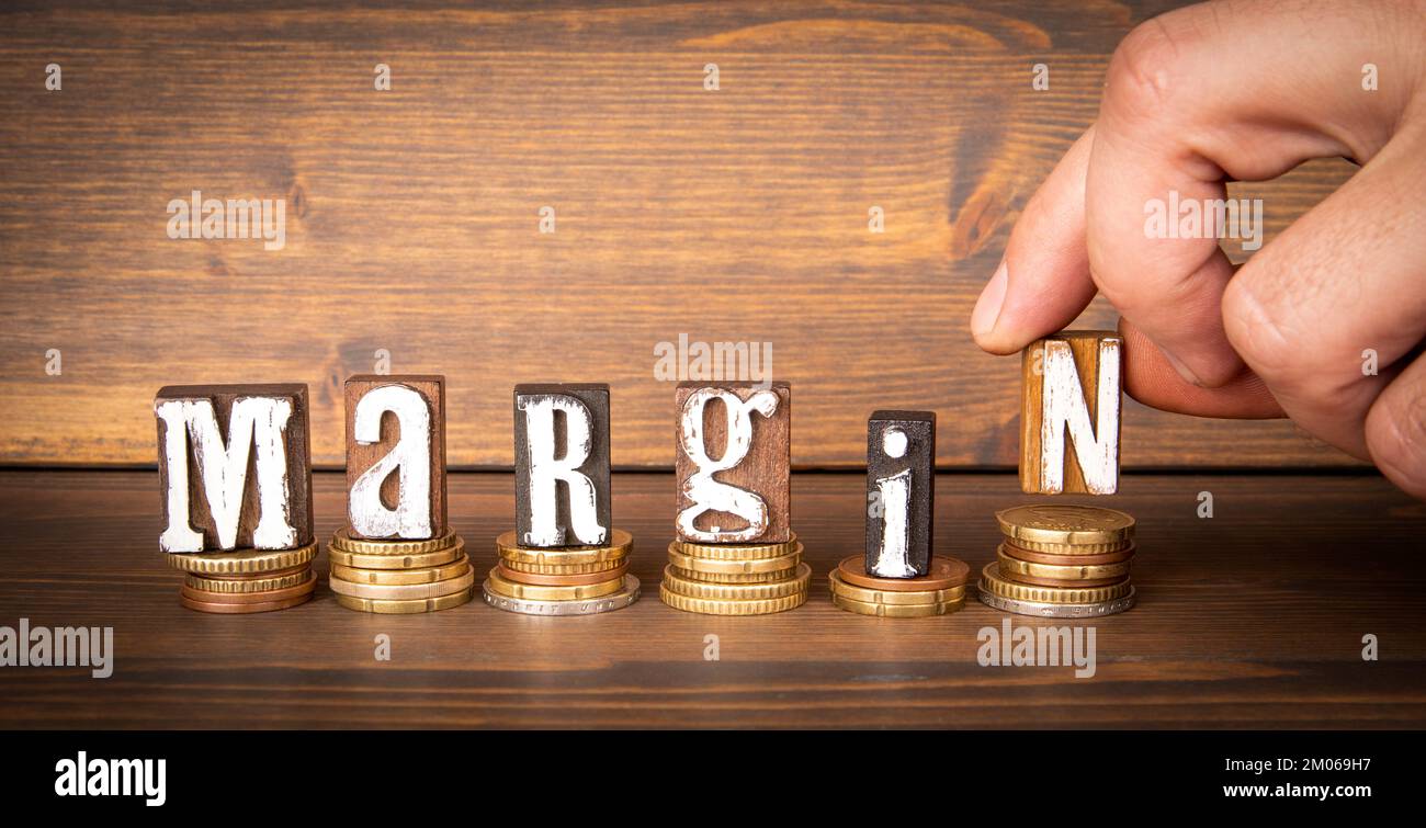 MARGIN - word on a wooden table. Business and finance concept. Stock Photo