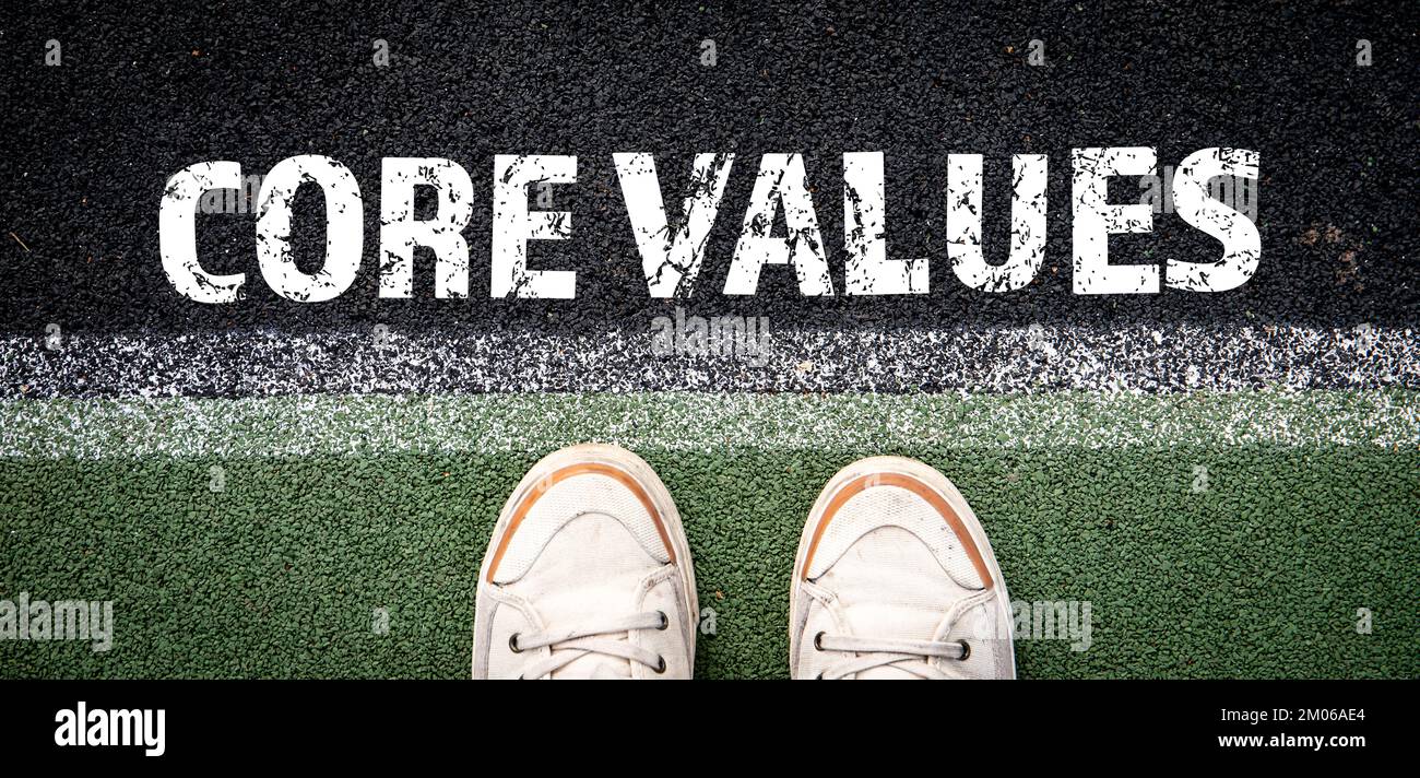 Core Values concept. Starting line and white sneakers. Stock Photo