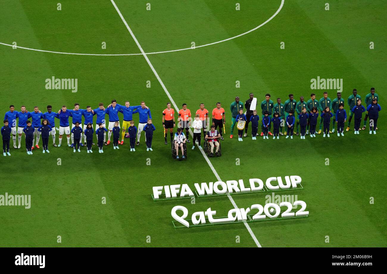 England and Senegal players line up ahead of the FIFA World Cup Round of Sixteen match at the Al-Bayt Stadium in Al Khor, Qatar. Picture date: Sunday December 4, 2022. Stock Photo