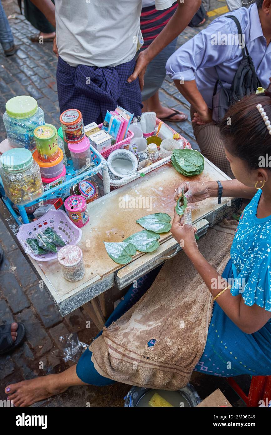 Kun-ya Vendor in Yangon Myanmar - also known as Paan - Chewing betel leaves with areca nuts and slaked lime paste is popular with locals Stock Photo
