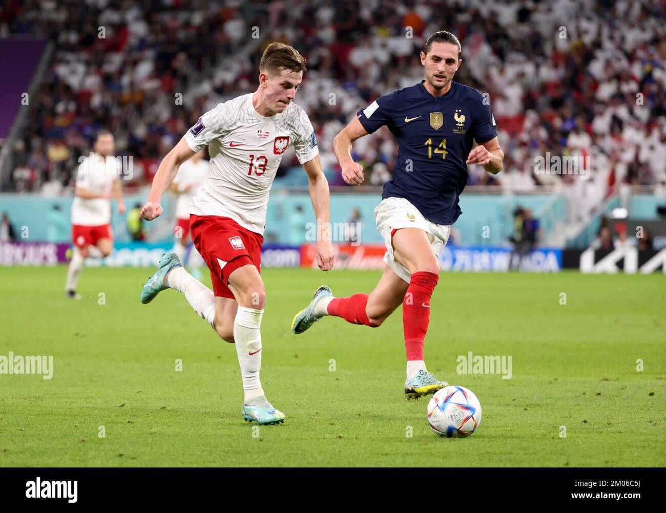 Adrien Rabiot of France, Jakub Kaminski of Poland (left) during the FIFA World Cup 2022, Round of 16 football match between France and Poland on December 4, 2022 at Al Thumama Stadium in Doha, Qatar - Photo Jean Catuffe / DPPI Stock Photo