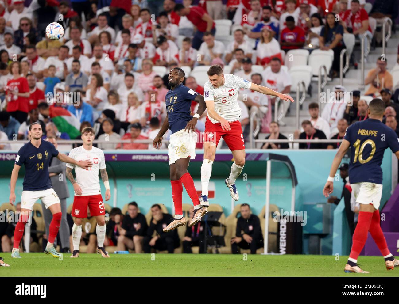 Marcus Thuram of France, Krystian Bielik of Poland during the FIFA World Cup 2022, Round of 16 football match between France and Poland on December 4, 2022 at Al Thumama Stadium in Doha, Qatar - Photo Jean Catuffe / DPPI Stock Photo