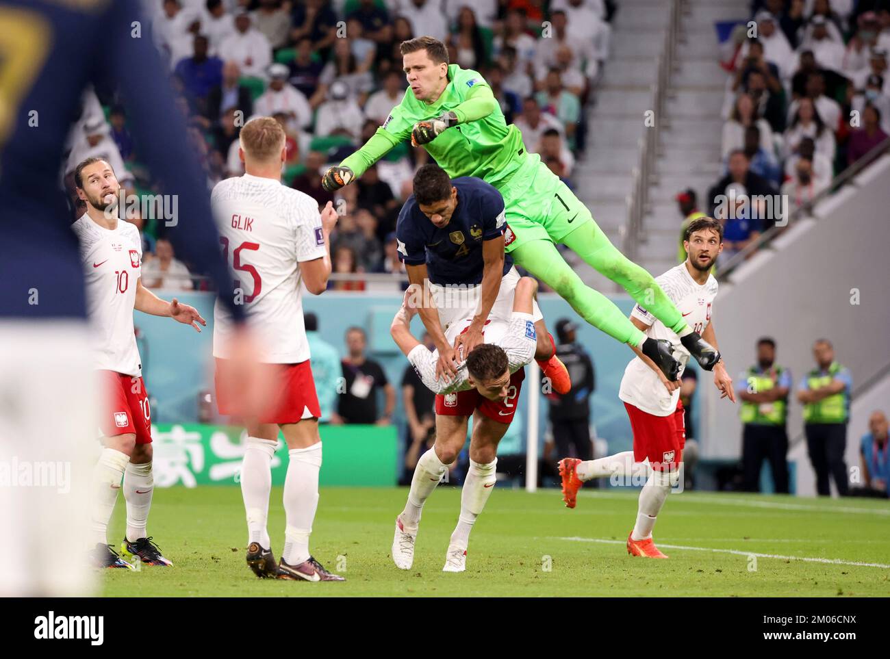 From top, Poland goalkeeper Wojciech Szczesny, Raphael Varane of France, Matty Cash of Poland during the FIFA World Cup 2022, Round of 16 football match between France and Poland on December 4, 2022 at Al Thumama Stadium in Doha, Qatar - Photo Jean Catuffe / DPPI Stock Photo