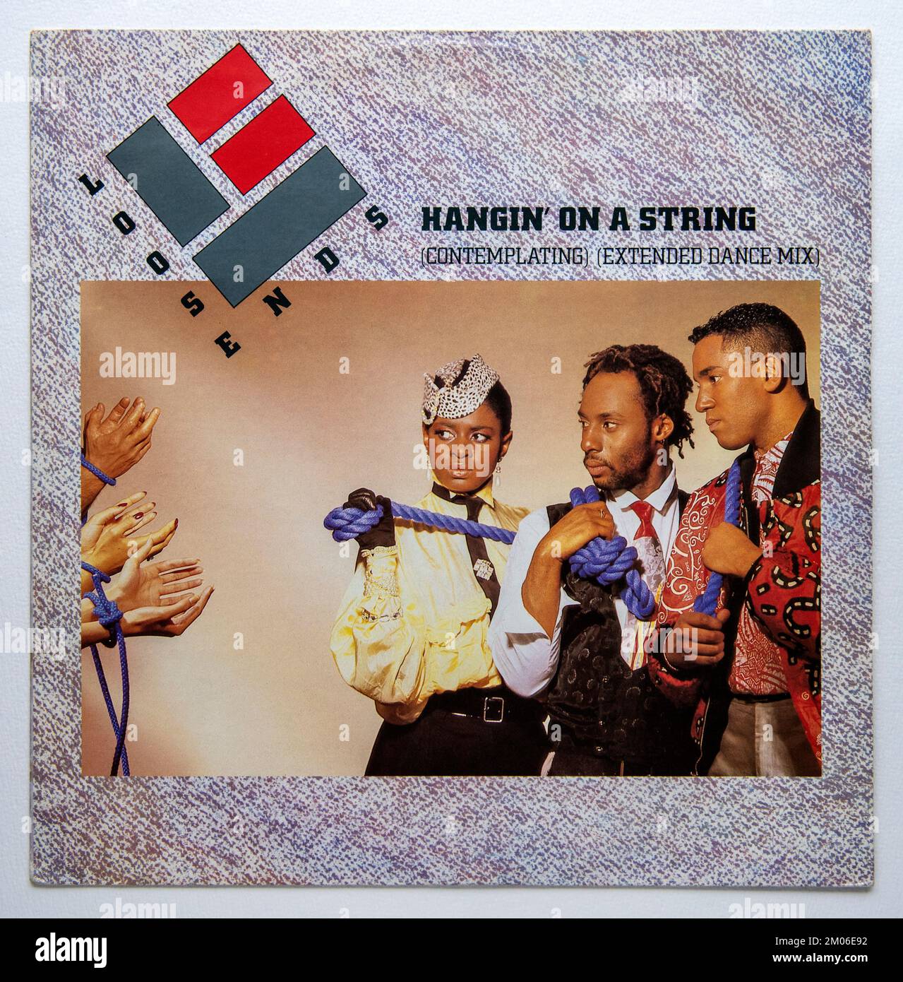 Picture cover of the 12 inch single version of Hangin' On a String by ...