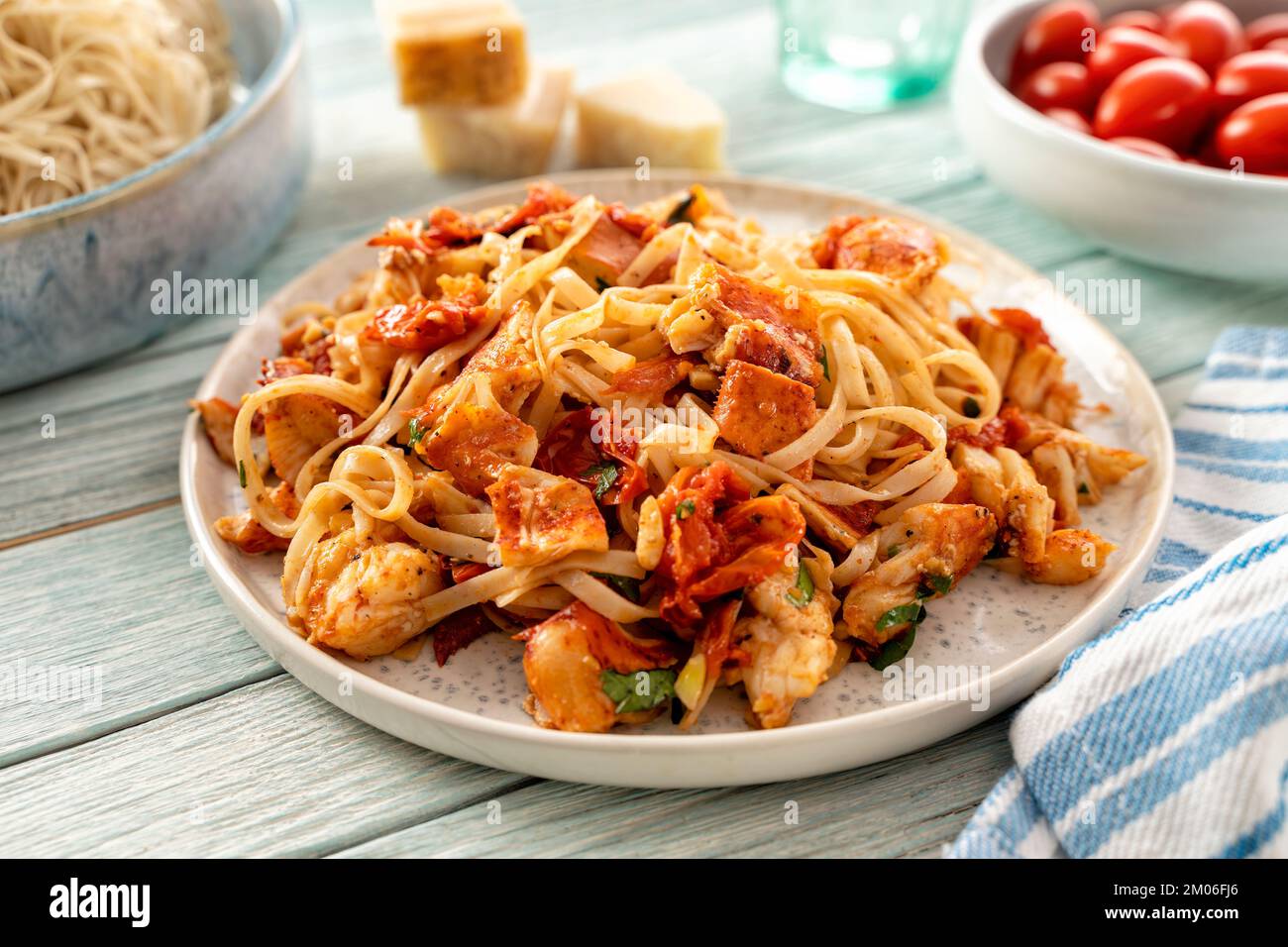 A plate of spicy delicious Lobster Fra Diavolo with tomatoes, chile peppers, garlic and parsley.. Stock Photo