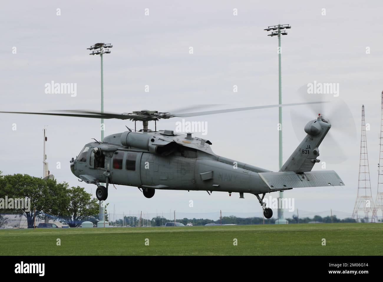 US Navy MH-60S Knighthawk taking off from a field at the US Naval Academy Stock Photo