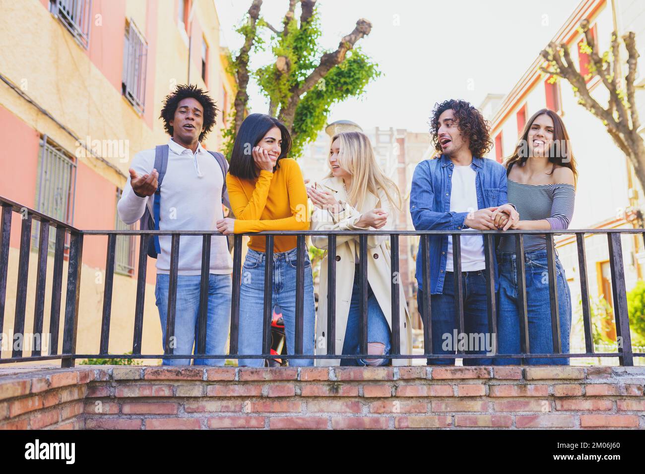 Group of content diverse friends chatting in city Stock Photo