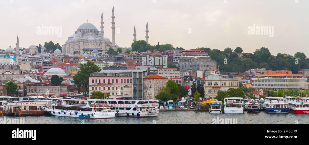 Istanbul, Turkey - June 28, 2016: Istanbul panoramic coastal view, Eminonu district. Coast of Golden Horn, Suleymaniye Mosque is on a background Stock Photo