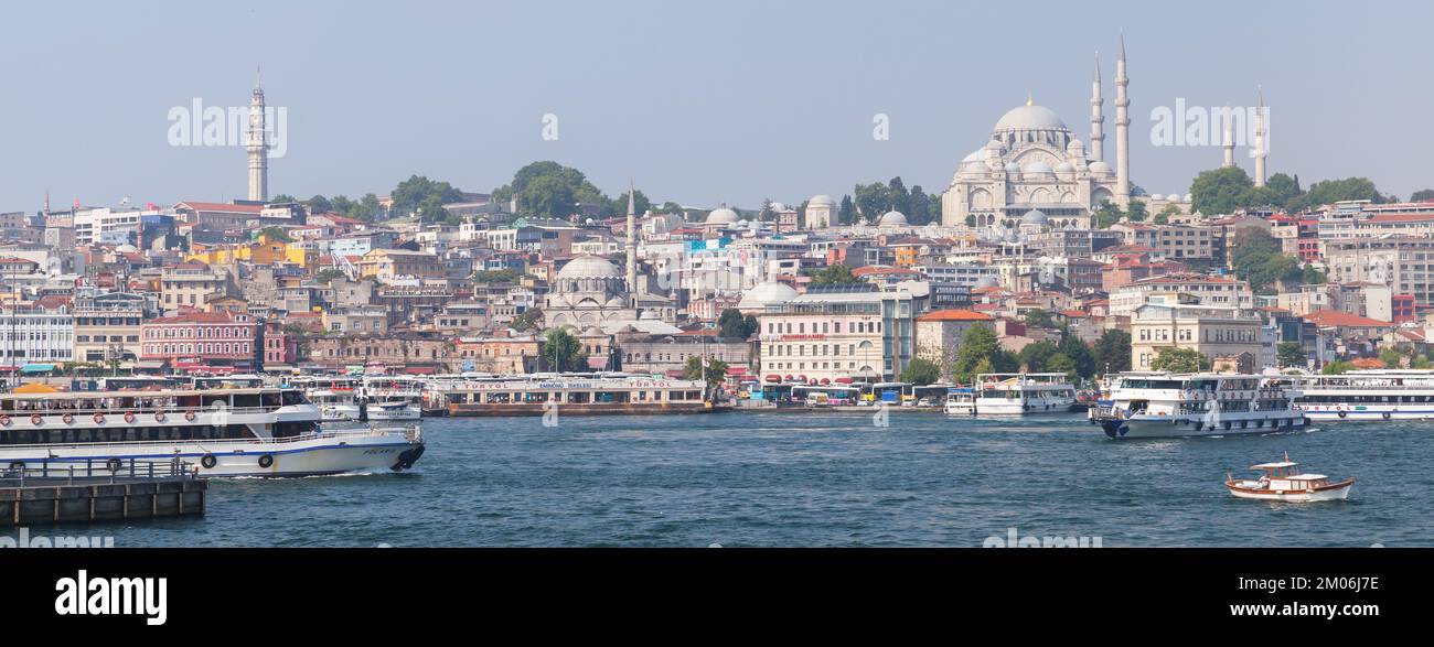 Istanbul, Turkey - July 1, 2016: Istanbul coastal panoramic cityscape. Golden Horn coast, Suleymaniye Mosque is on a background Stock Photo