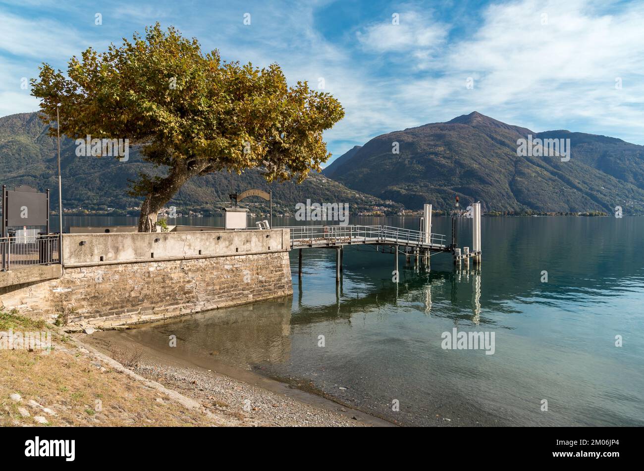 Landscape of Lake Como with the pier of the Cremia village at autumn time, Lombardy, Italy Stock Photo