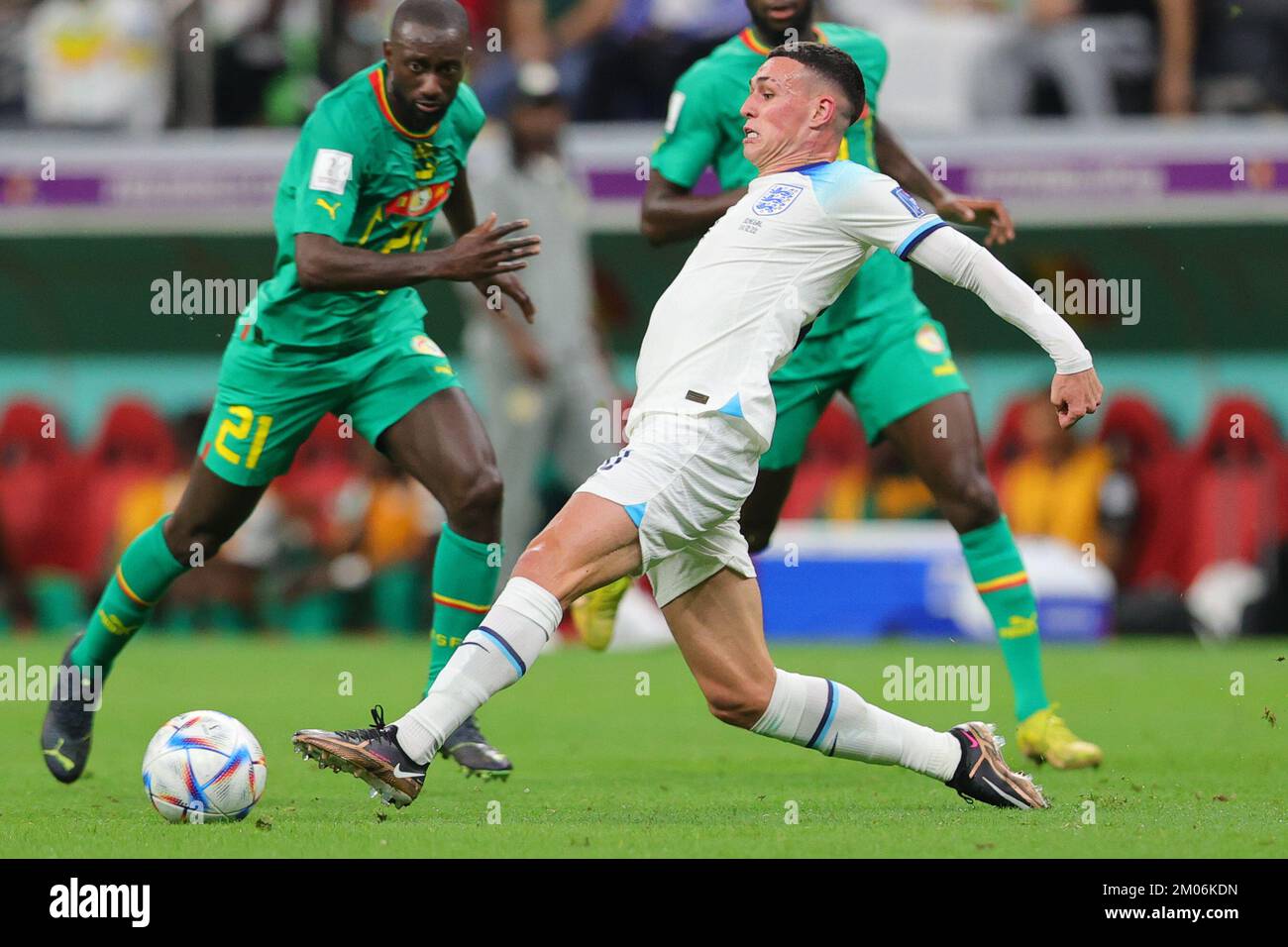 Al Khor, Qatar. 04th Dec, 2022. Phil Foden of England passes the ball during the FIFA World Cup Qatar 2022 round of 16 match between England and Senegal at Al Bayt Stadium, Al Khor, Qatar on 4 December 2022. Photo by Peter Dovgan. Editorial use only, license required for commercial use. No use in betting, games or a single club/league/player publications. Credit: UK Sports Pics Ltd/Alamy Live News Stock Photo