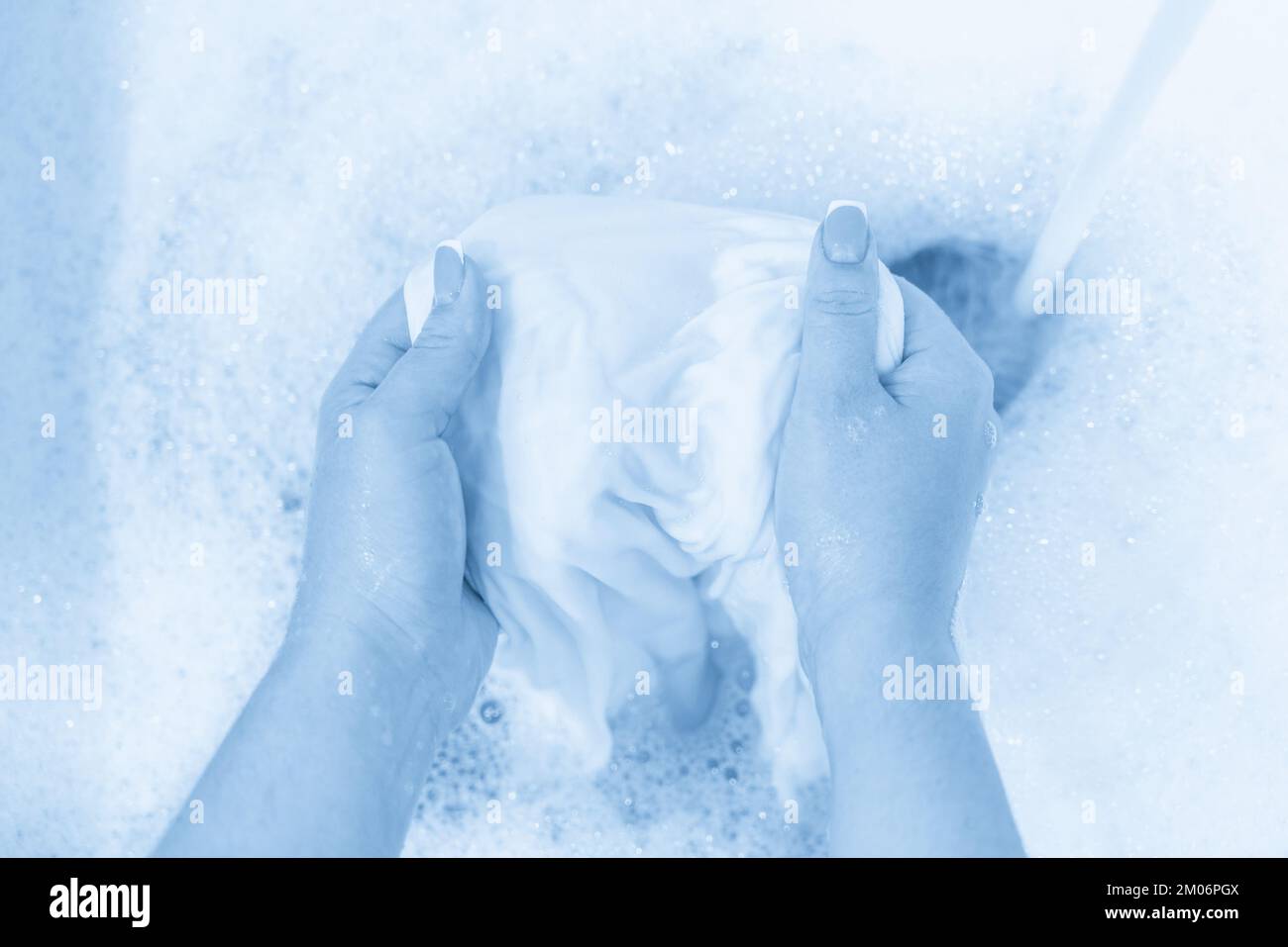 Hand washing white clothes in sink to bleach Stock Photo Alamy