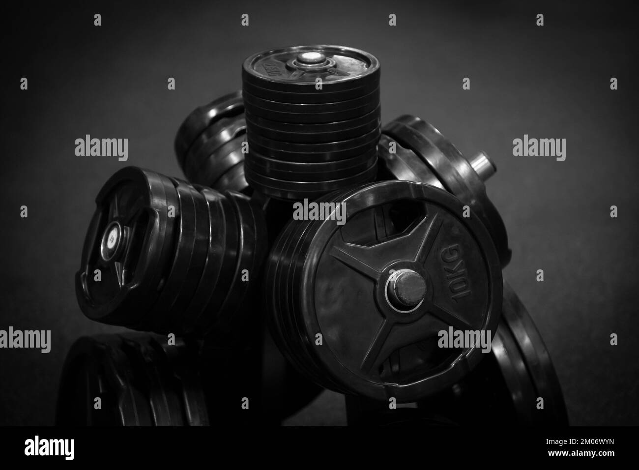 Close up of dumbbells on dark backgound. Sport and fitness equipment. Horizontal sport poster, greeting cards, headers, website. Stock Photo