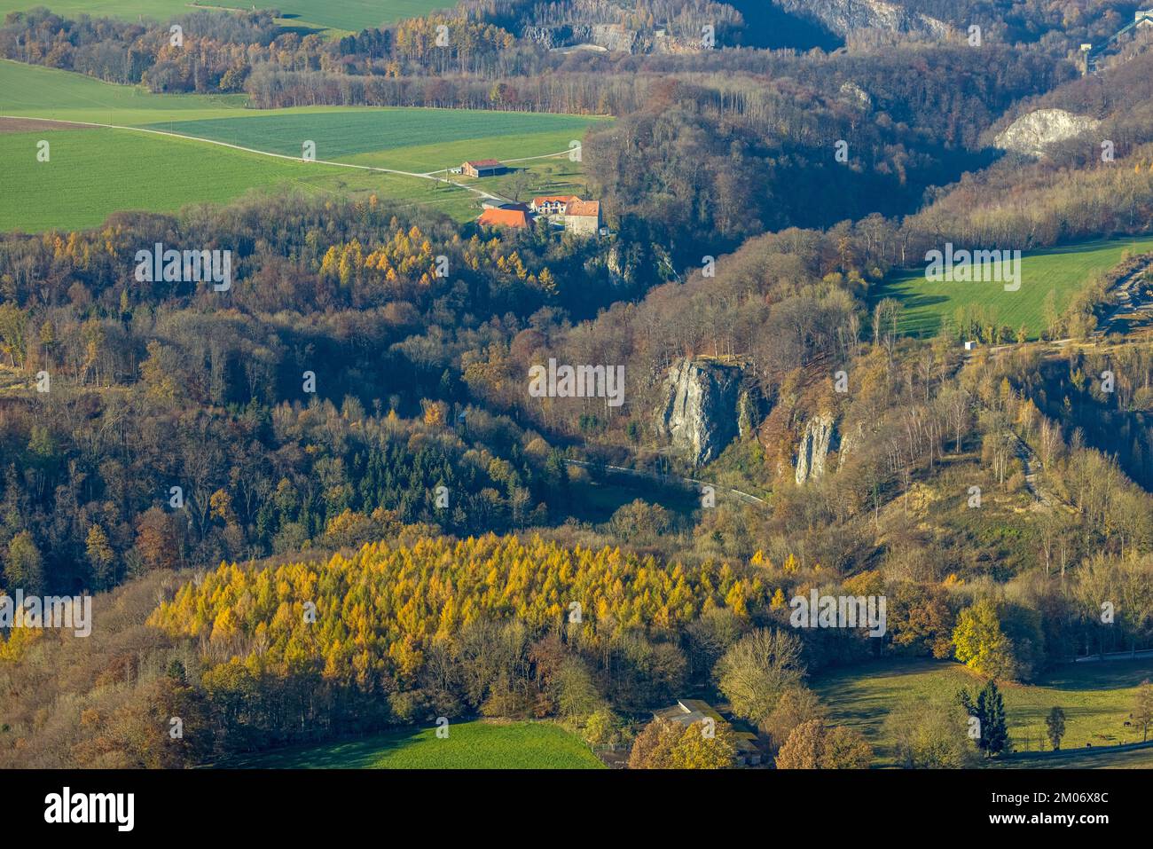 Aerial view, Reckenhöhle dripstone cave in autumnal forest in Volkringhausen district in Balve, Sauerland, North Rhine-Westphalia, Germany, Prize, DE, Stock Photo