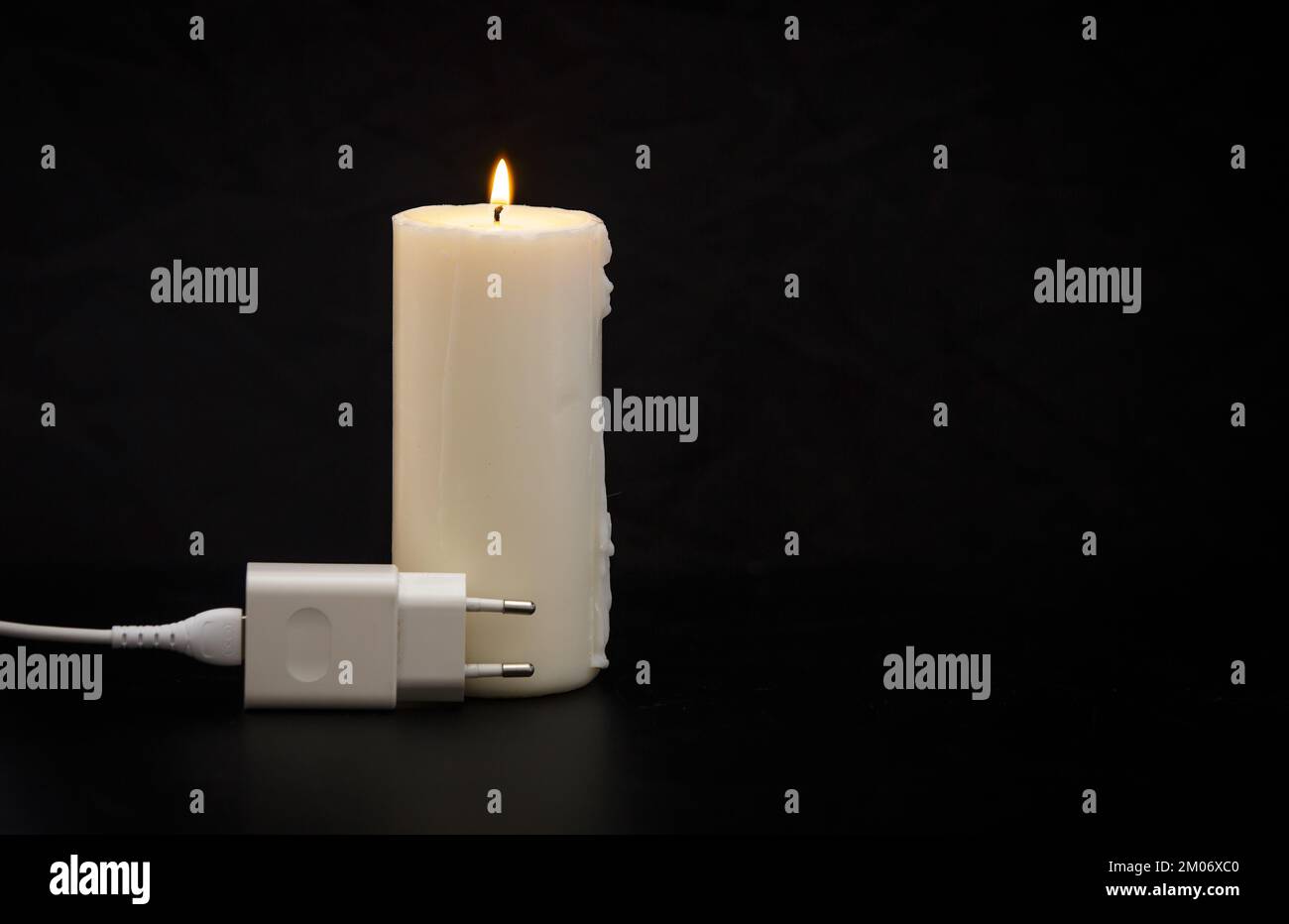 Candles in a dark room. Burning candles on the table and sockets on the  background. No electricity in the house. Blackout in the city. Power outage,  energy crisis concept 28623602 Stock Video