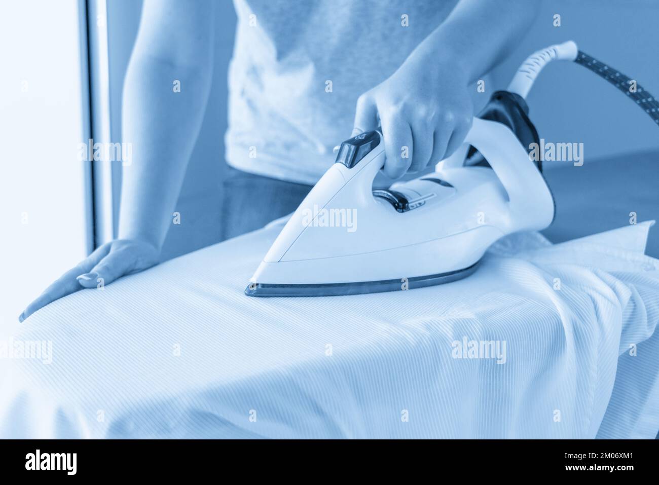 Ironing white shirt hires stock photography and images Alamy
