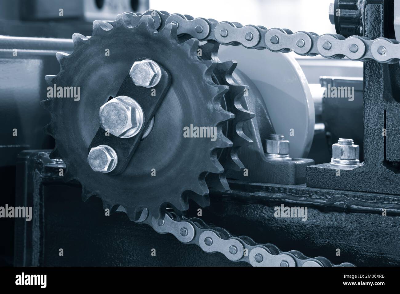 Gear chain drive shaft in conveyor belt is on production line. Timing chain of car, tensioners