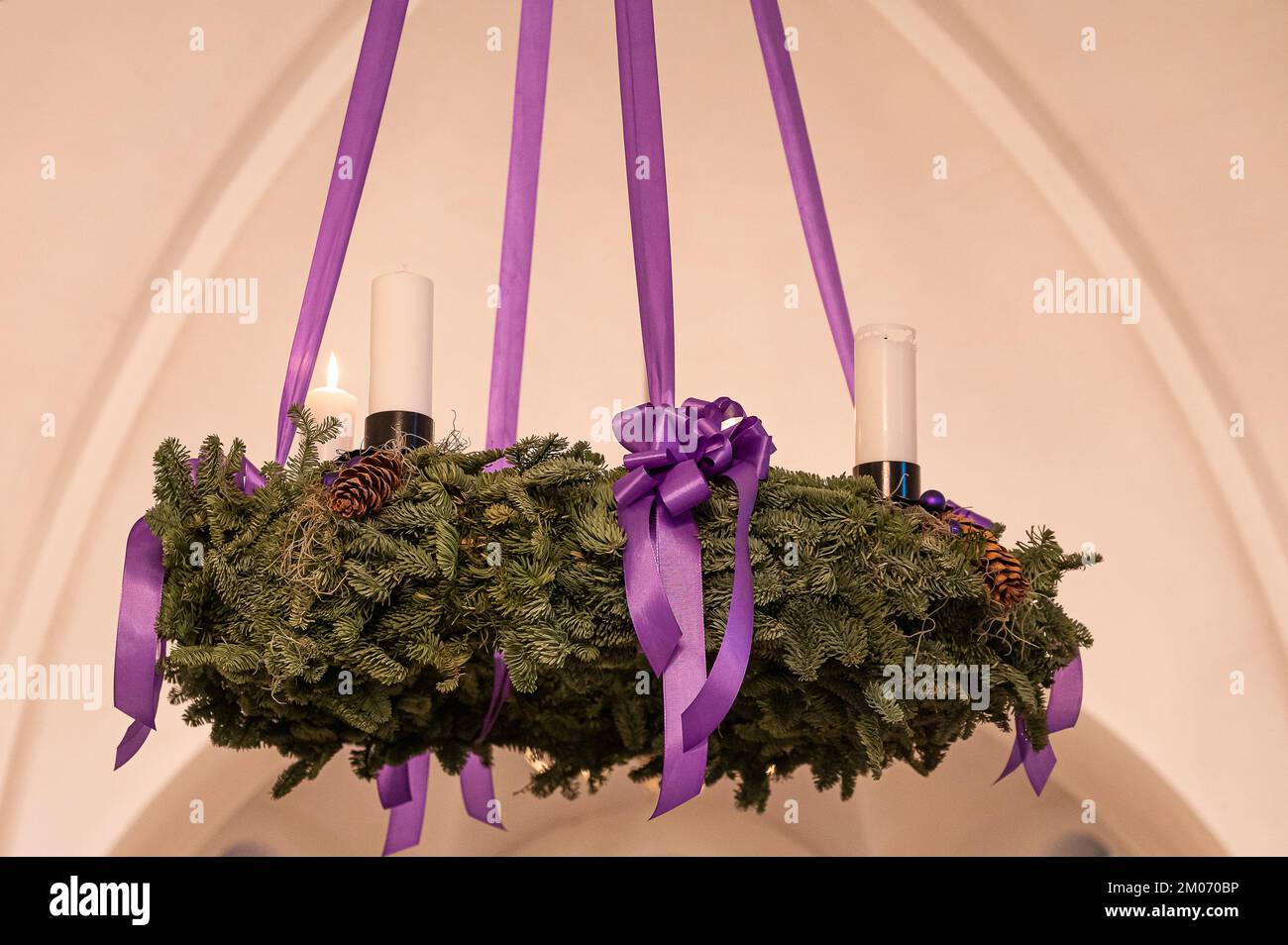 evergreen wreath with four candles under the ceiling in Frederikssund church on the second Sunday in Advent, Denmark, december 4, 2022 Stock Photo