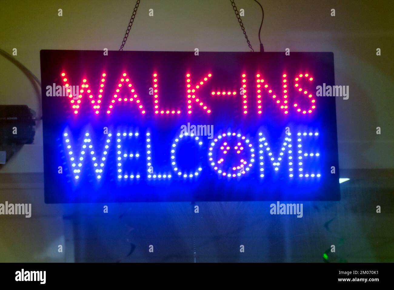 business neon  sign walk ins welcome Stock Photo