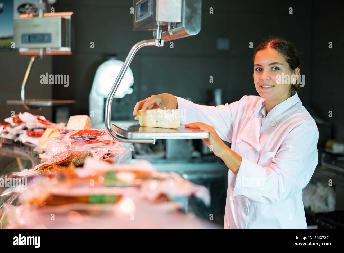 Butcher weighing meat on scale hi-res stock photography and images - Alamy