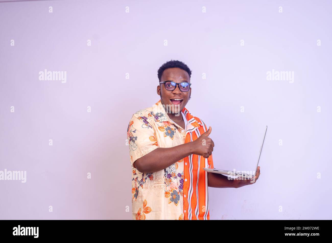 Thumbs up african man laptop hi-res stock photography and images - Alamy