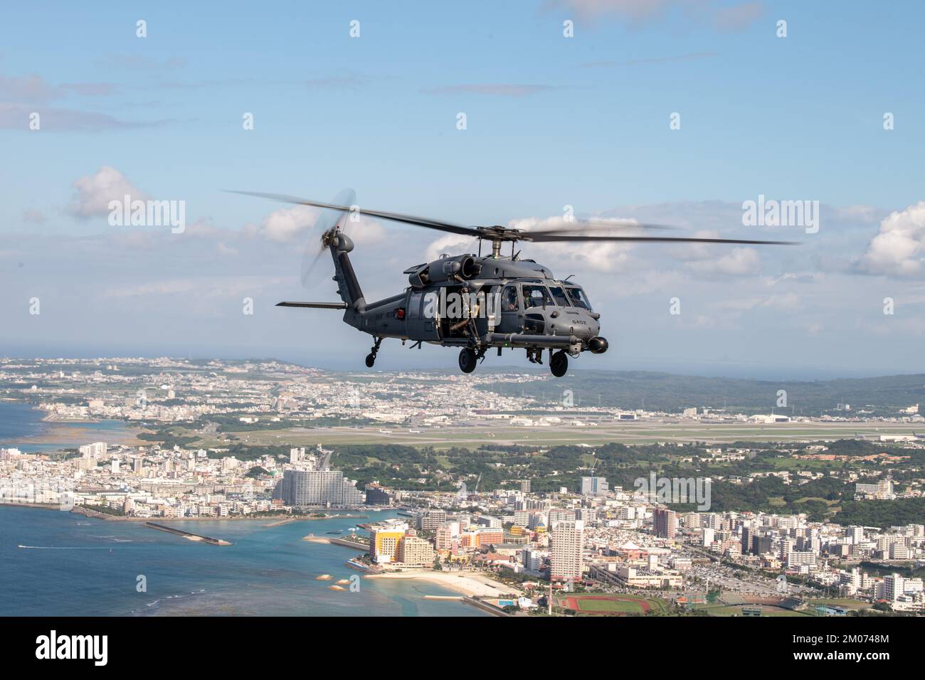 A 33rd Rescue Squadron HH-60 Pave Hawk flies over Okinawa, Japan, Nov. 22, 2022. The 33rd RQS conducts extensive training in various rescue scenarios to ensure they are ready to effectively respond to real-world contingencies. (U.S. Air Force photo by Senior Airman Cesar J. Navarro) Stock Photo
