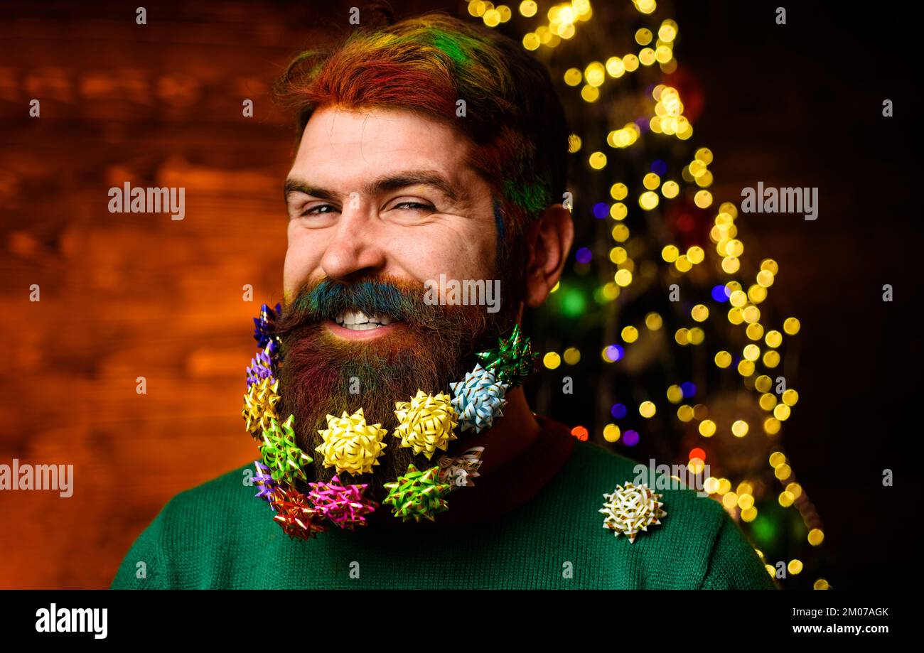 Christmas beard style. Funny bearded man in festive concept. New year holiday. Stock Photo