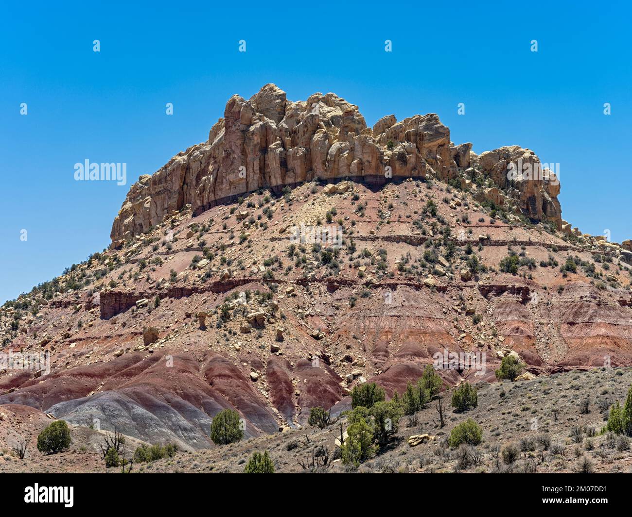 A rock formation towers over Burr Trail Road in the Grand Staircase-Escalante National Monument in Utah, USA Stock Photo