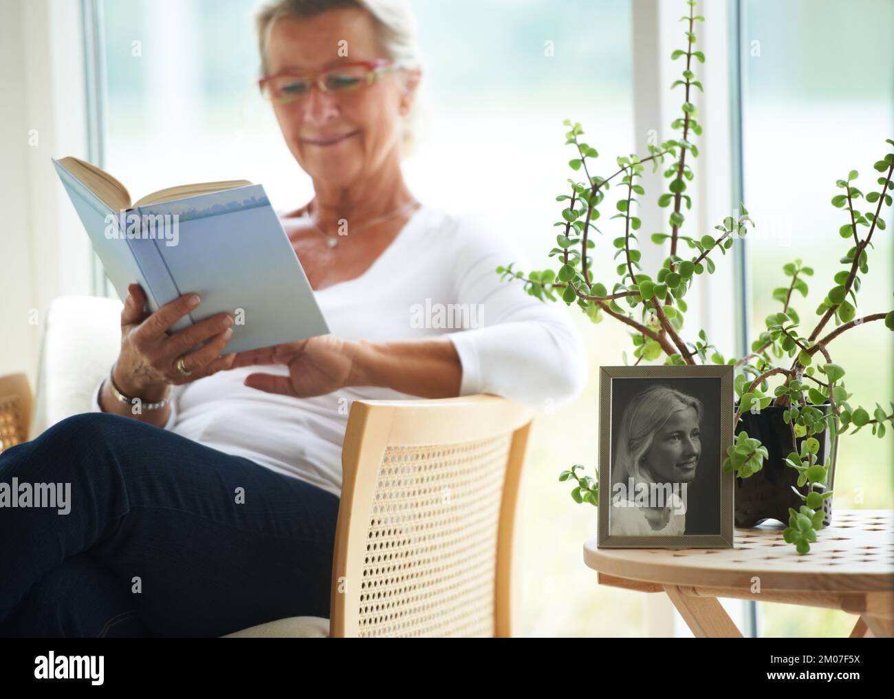 Relaxing with a good book. A senior woman reading a great book in her