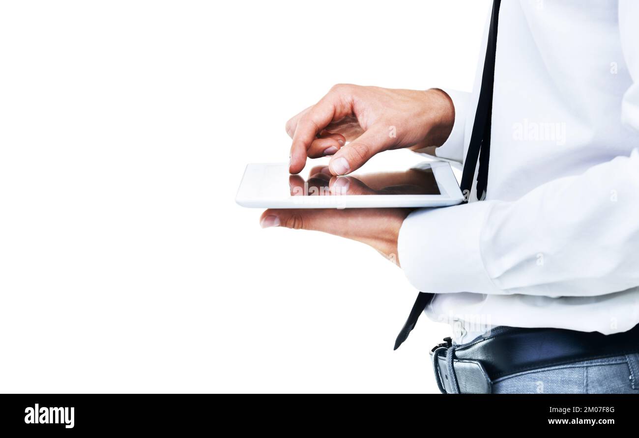 Technology is my life. A side view of a man touching his touch screen with white background. Stock Photo