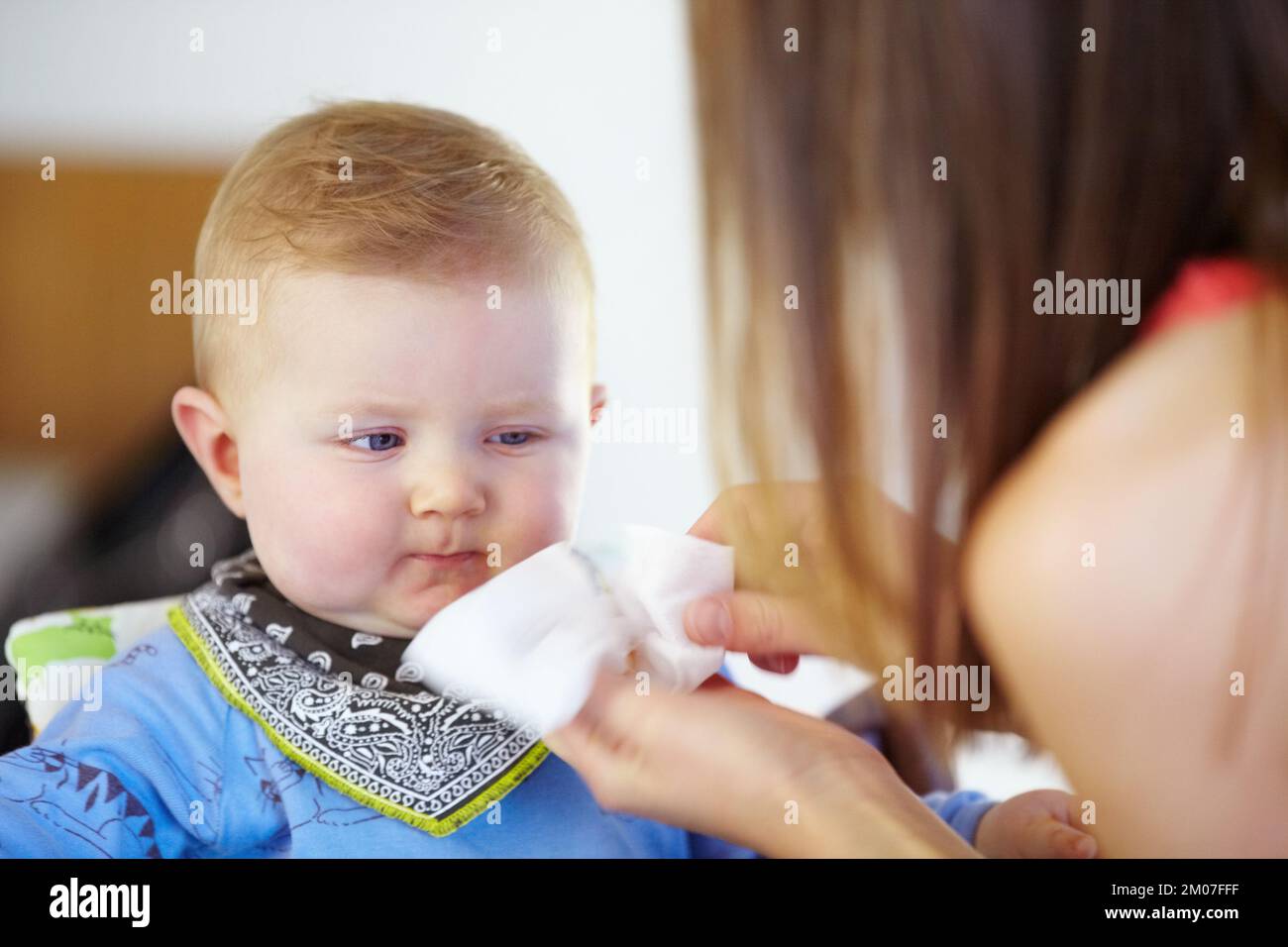 Cleaning up after a tasty meal Baby care. Young baby boy having his