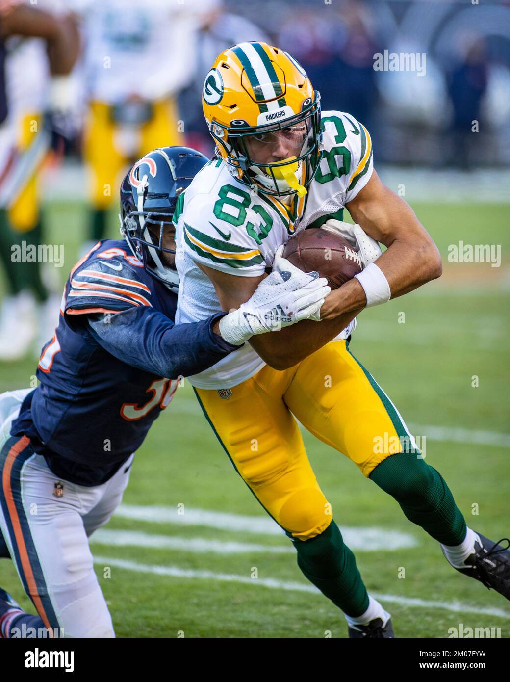 Chicago, IL, USA. 04th Dec, 2022. Chicago Bears #36 DeAndre Houston-Carson tackles Packers #23 Samori Toure during a game against the Green Bay Packers in Chicago, IL. Mike Wulf/CSM/Alamy Live News Stock Photo