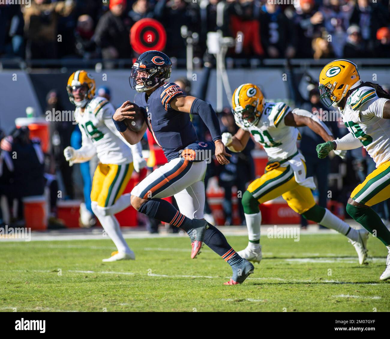 Chicago Bears quarterback Justin Fields runs against the