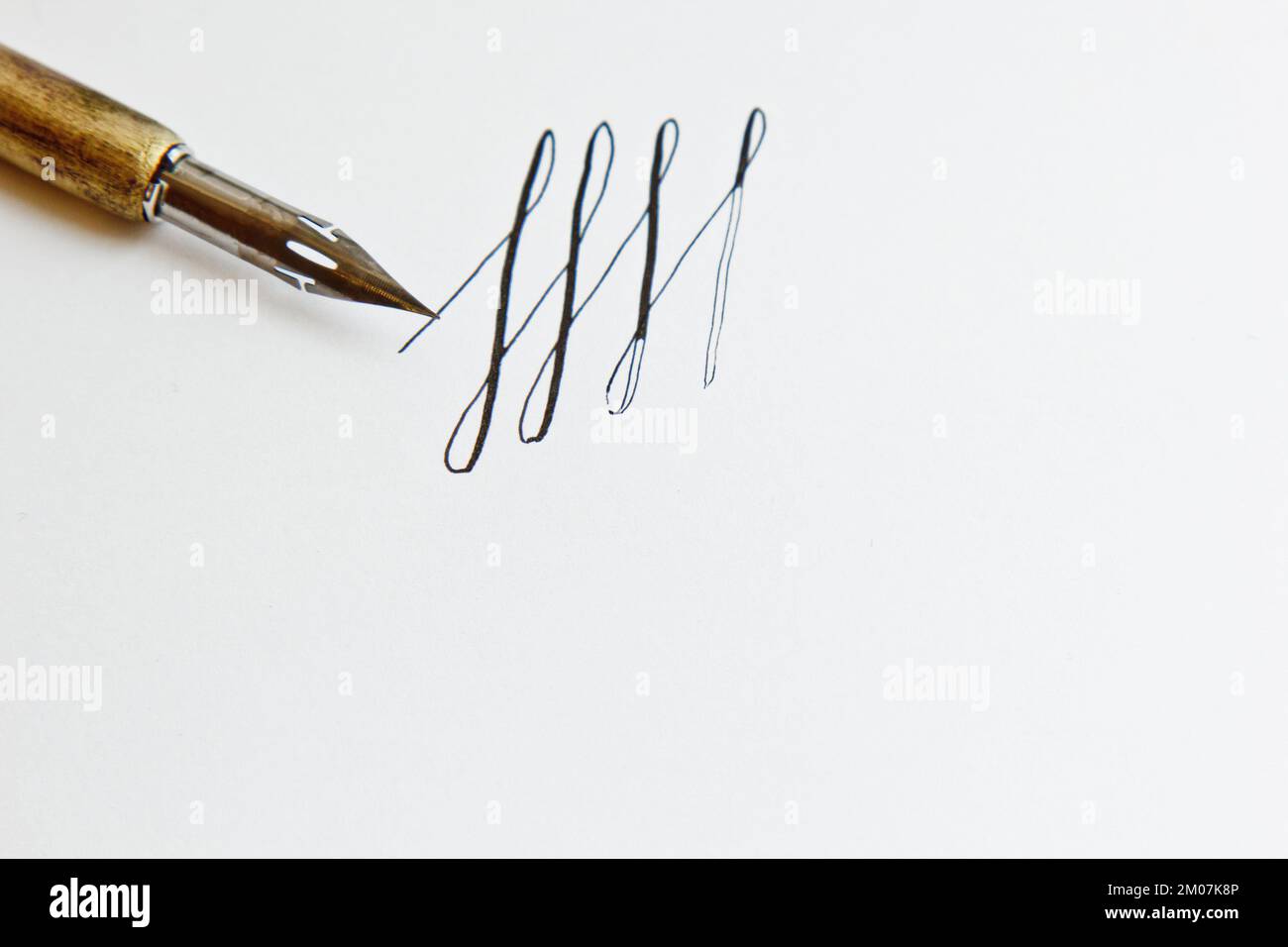 patterns drawn with an ink pen on a white paper sheet with stripes ...