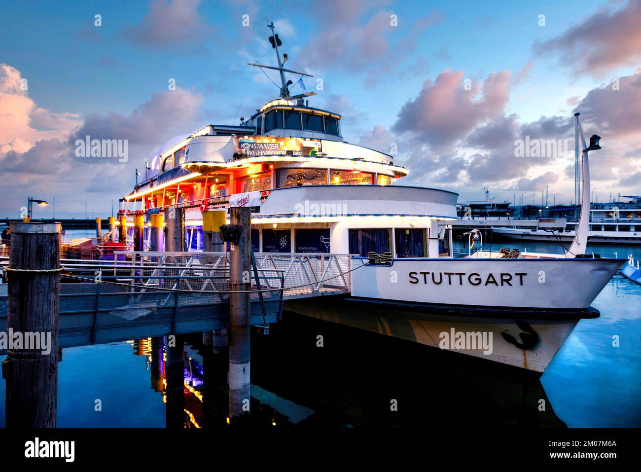Constance, Germany. The illuminated Christmas ship with 360° panorama bar on the shore of Lake Constance. Konstanz, Germany. Das beleuchtete Weihnacht Stock Photo