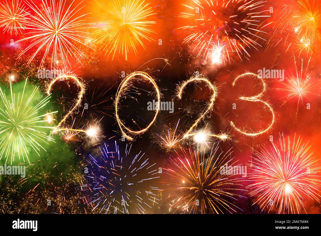 2023 happy new year firework banner. Sparks, fireworks and sparklers on black night sky as a holiday background Stock Photo