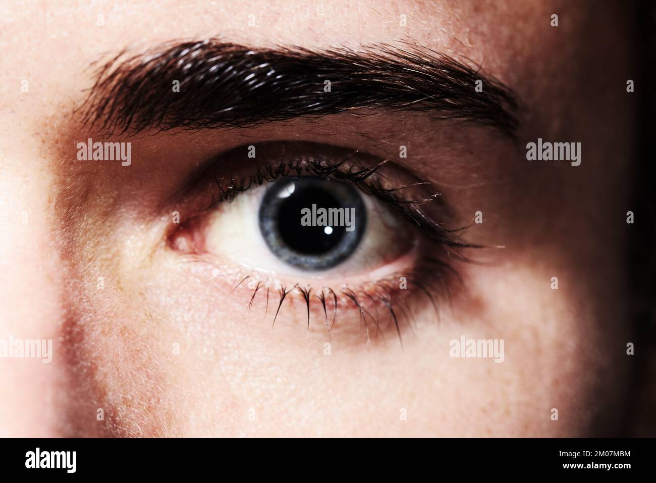 Seeing something he likes. Closeup portrait of an eye with dilated pupil. Stock Photo