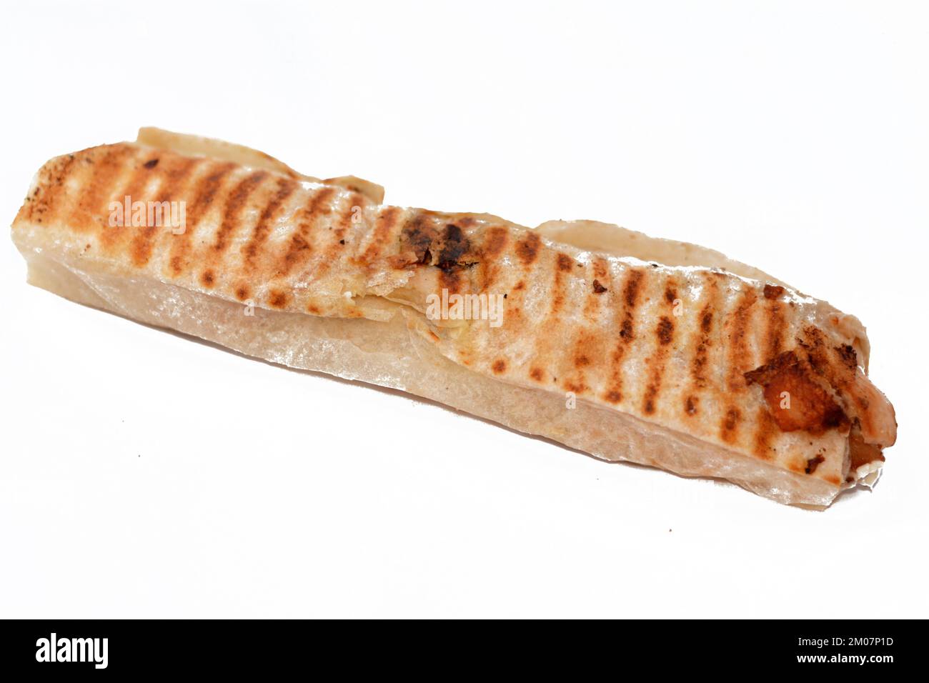 Syrian recipe cuisine background, chicken shawerma or shawarma tortilla wrap with onion, tomato, lettuce and garlic sauce in Syrian bread isolated on Stock Photo