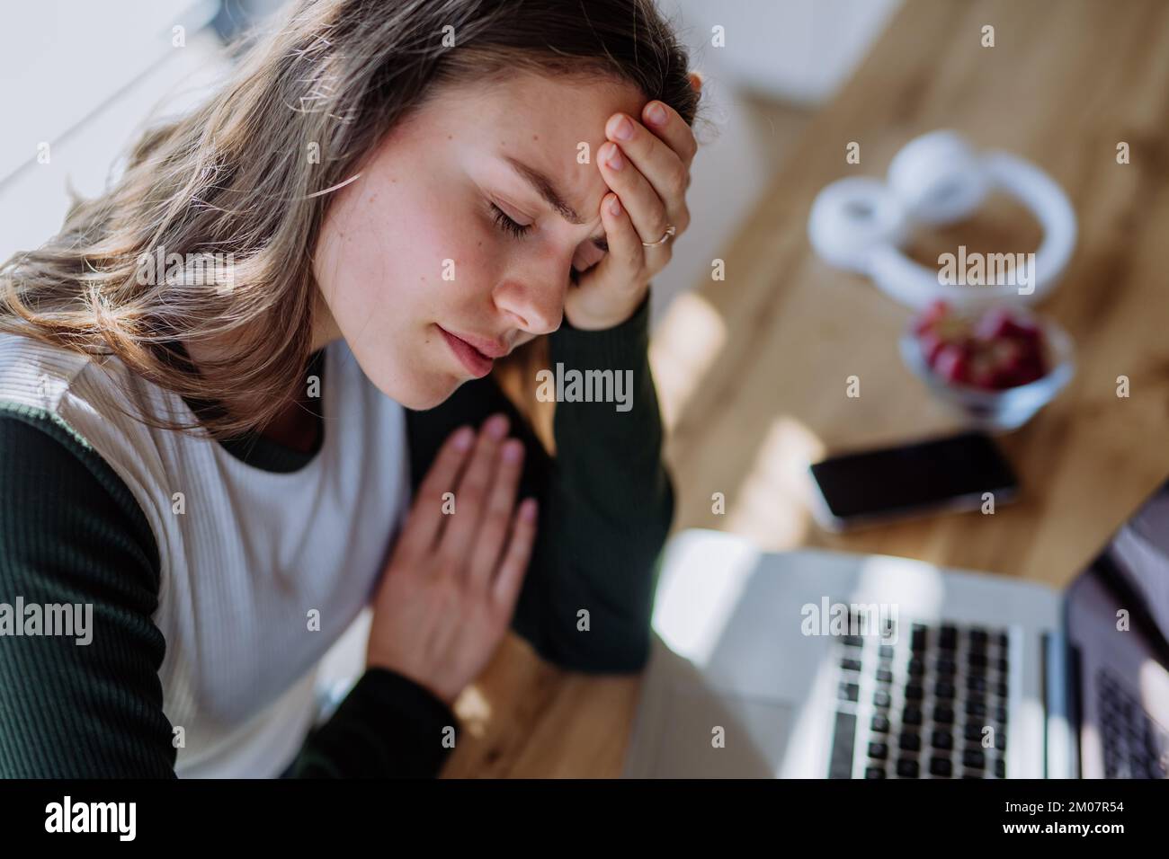 Portrait of tired woman with tablet, homeoffice concept. Stock Photo