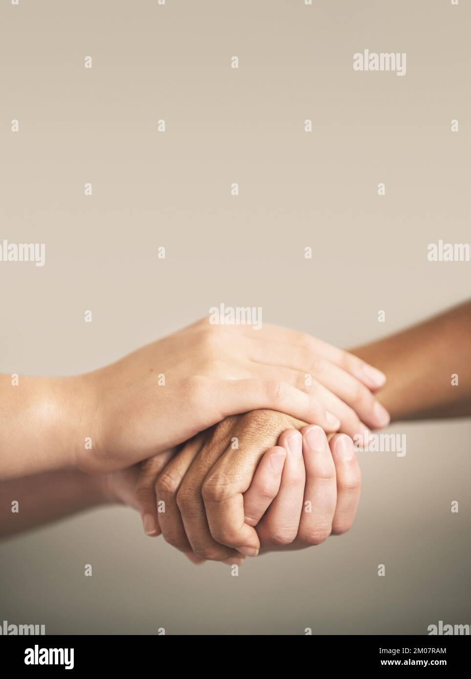 Helping the weak will make you strong. two people holding hands in