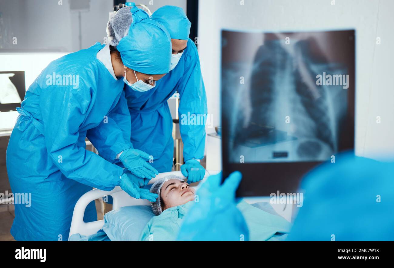 Patient, surgeon and team in operating room, hospital and healthcare emergency, surgery or medical clinic. Doctors, nursing staff or workers in face Stock Photo