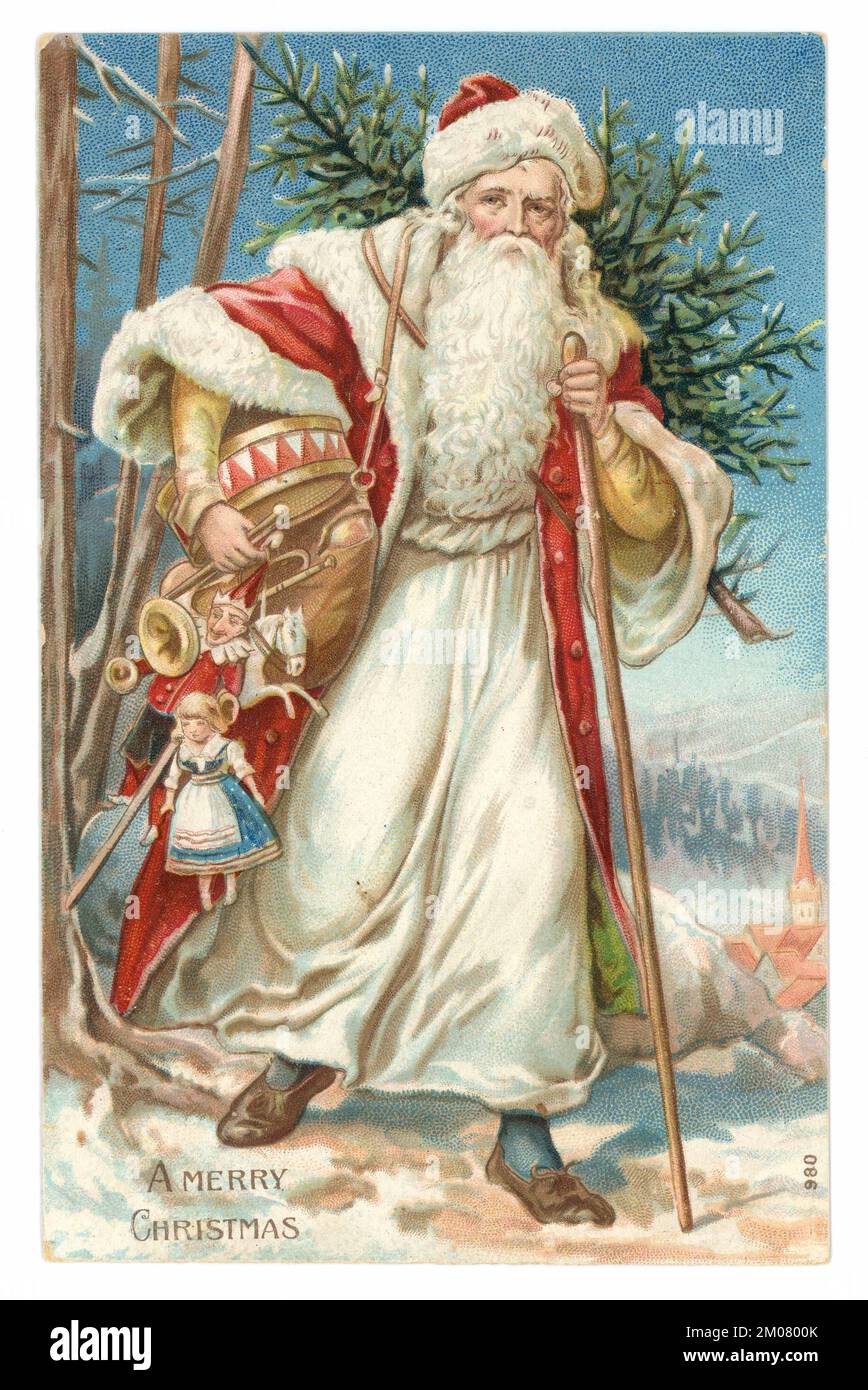Original charming and very classic Victorian Christmas card or Edwardian period Christmas card of a traditional Victorian Father Christmas, Victorian Santa Claus, carrying a Christmas tree and old fashioned children's toys, with the message 'A Merry Christmas' U.K. Circa 1907 Stock Photo